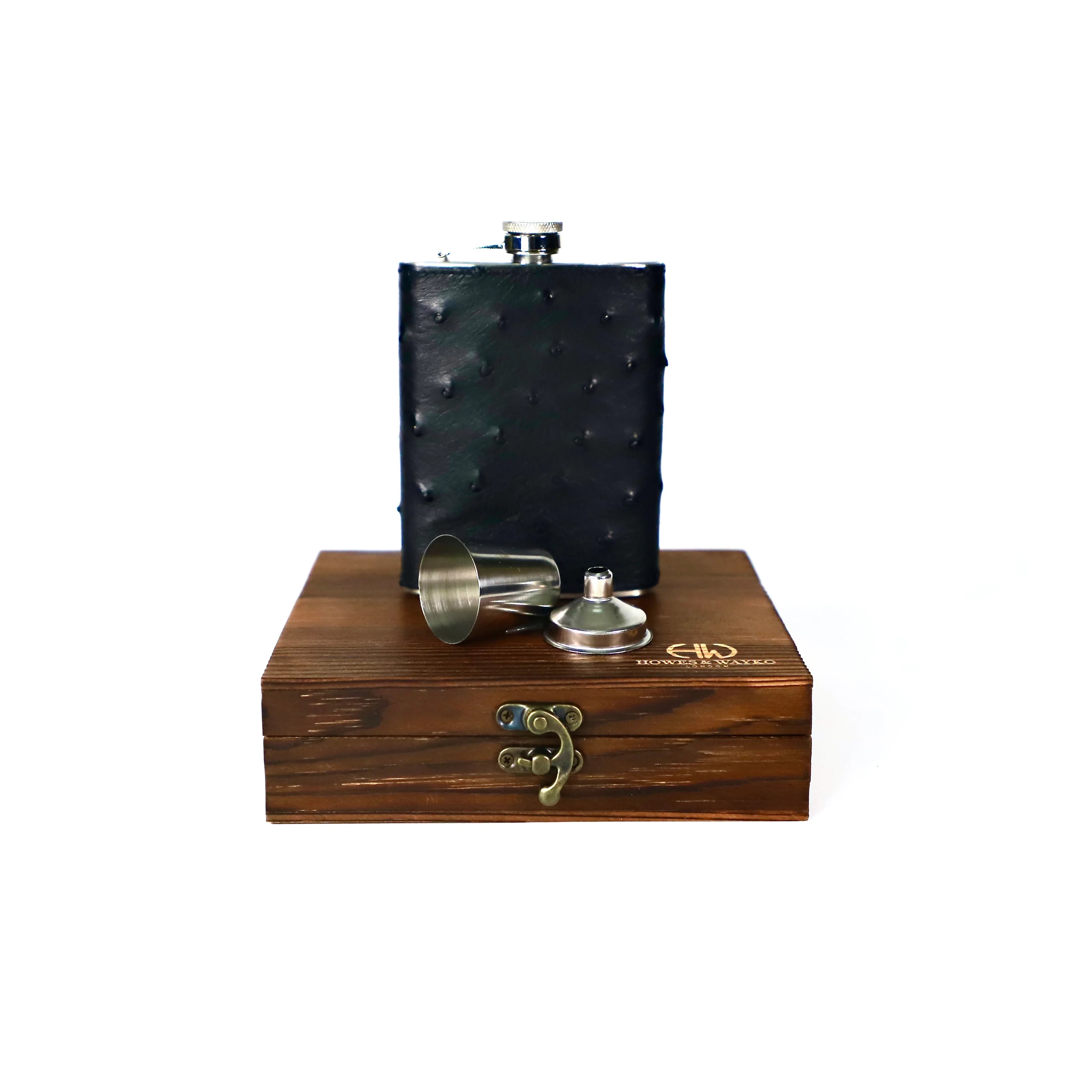 Flask set with black Ostrich leather cover and wooden box on a white background