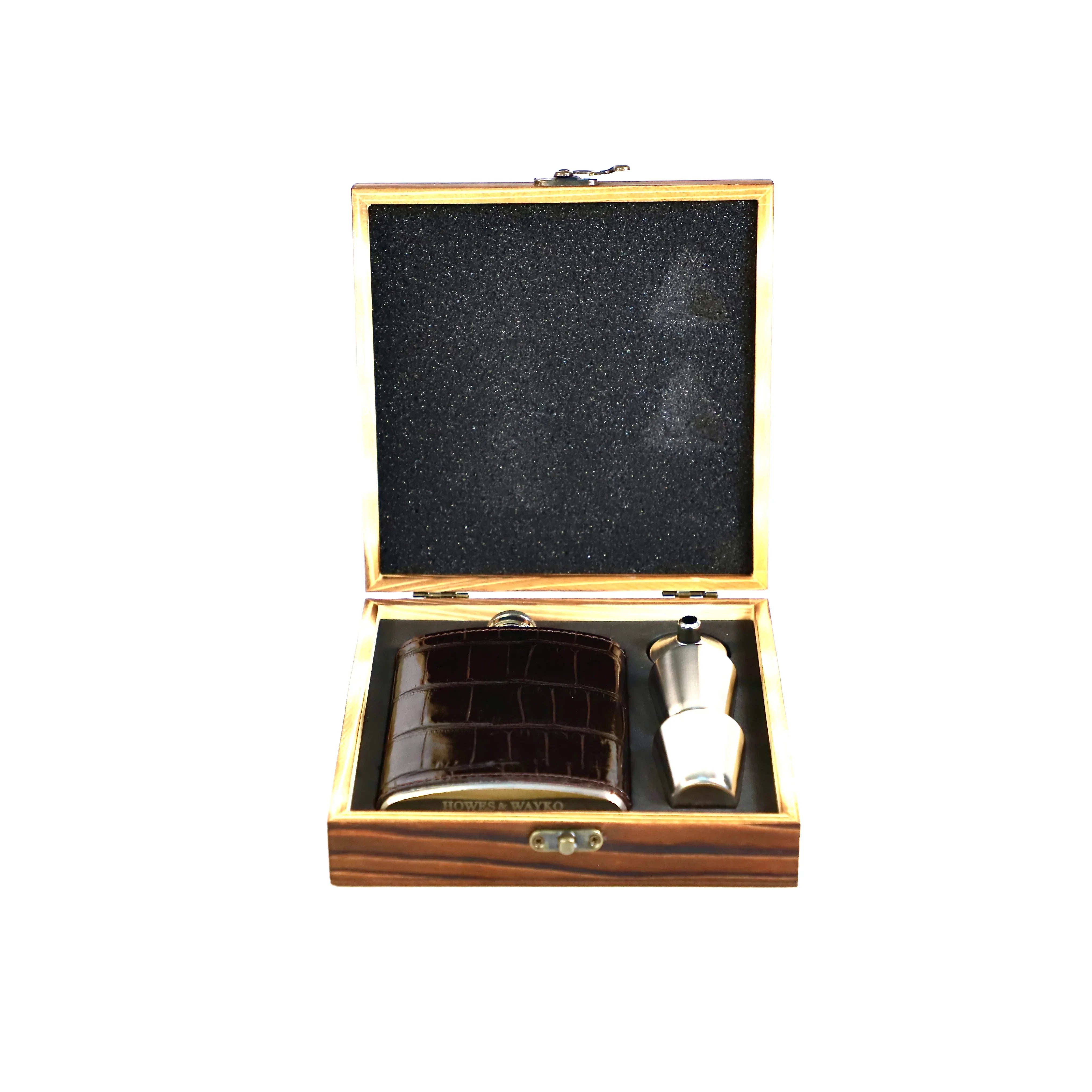 Wooden case with a black interior containing a silver hip flask and leather pouch on a white background.