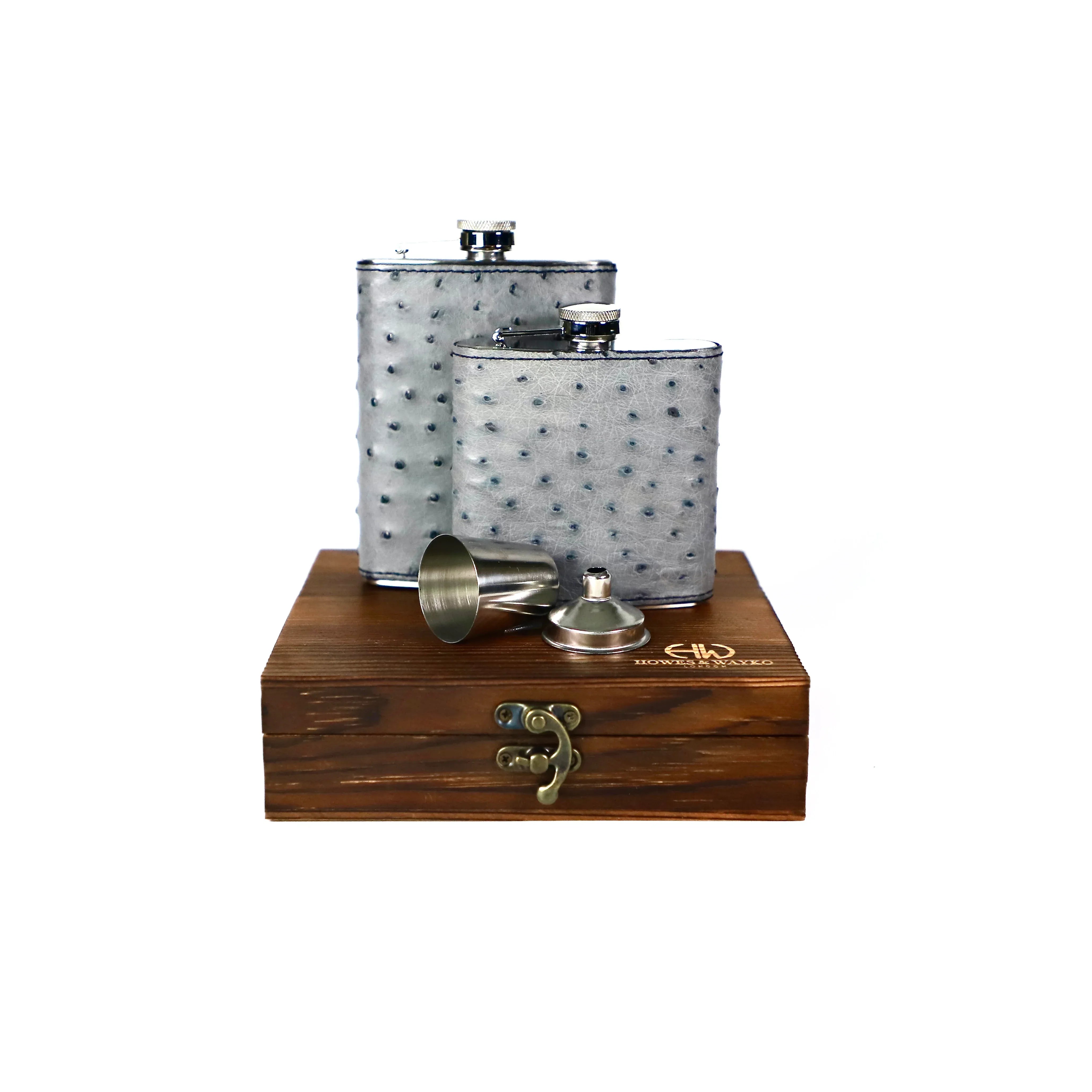 Two silver flask, covered with grey Ostrich leather and dispayed on a wooden gift box