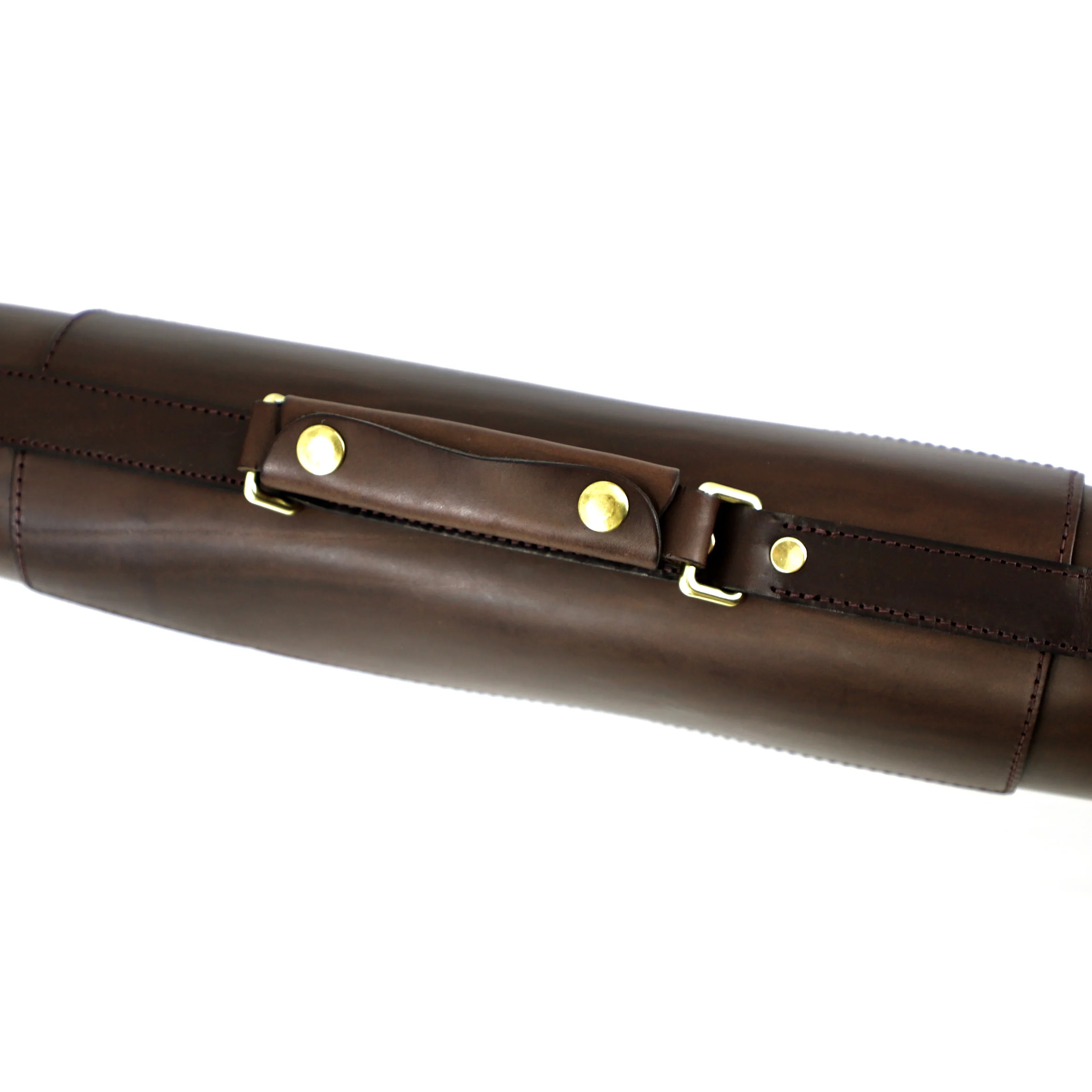 chocolate brown vegetable-tanned leather gunslip close up of handle and brass finishes