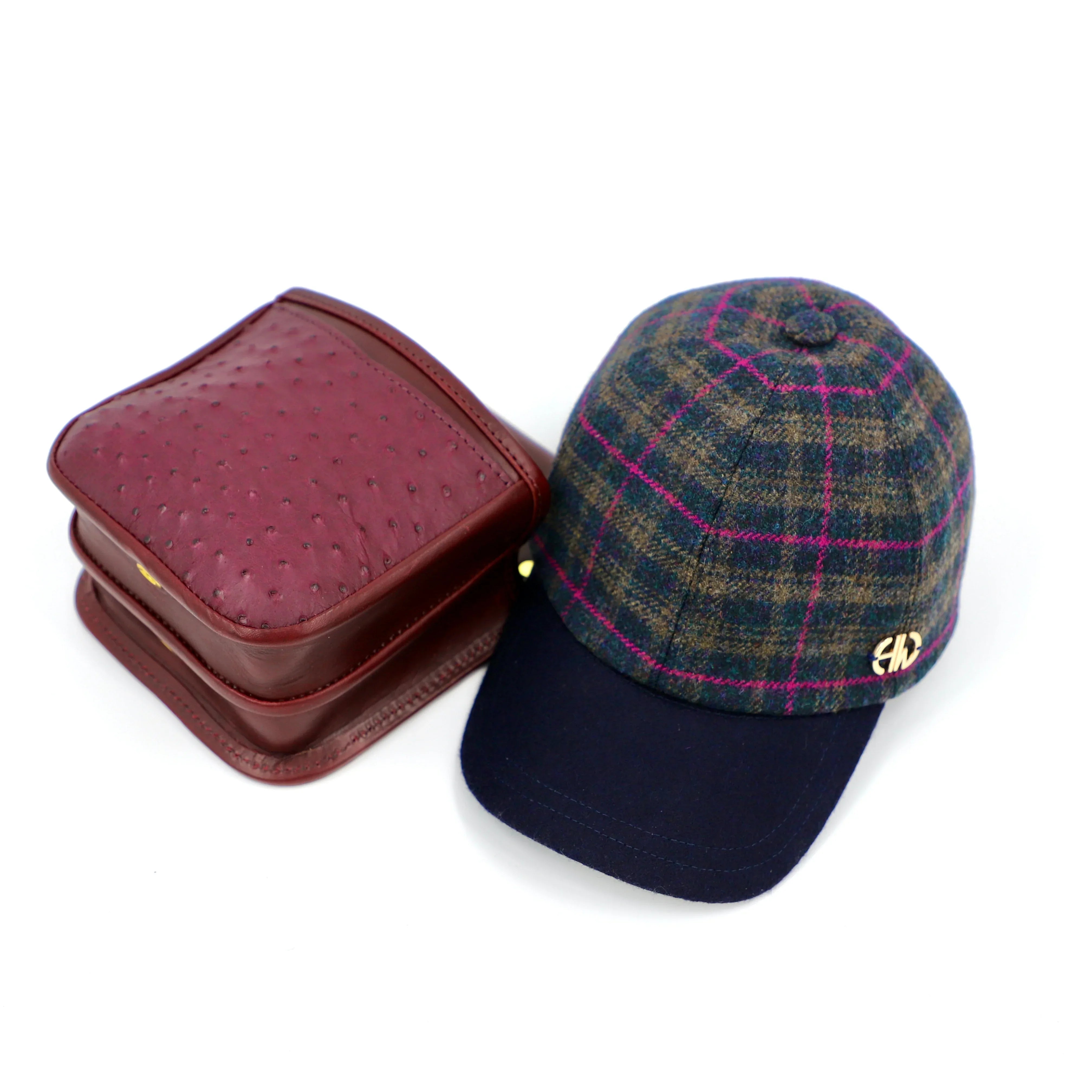 shooting baseball cap with a cartridge pouch next to it as a combo