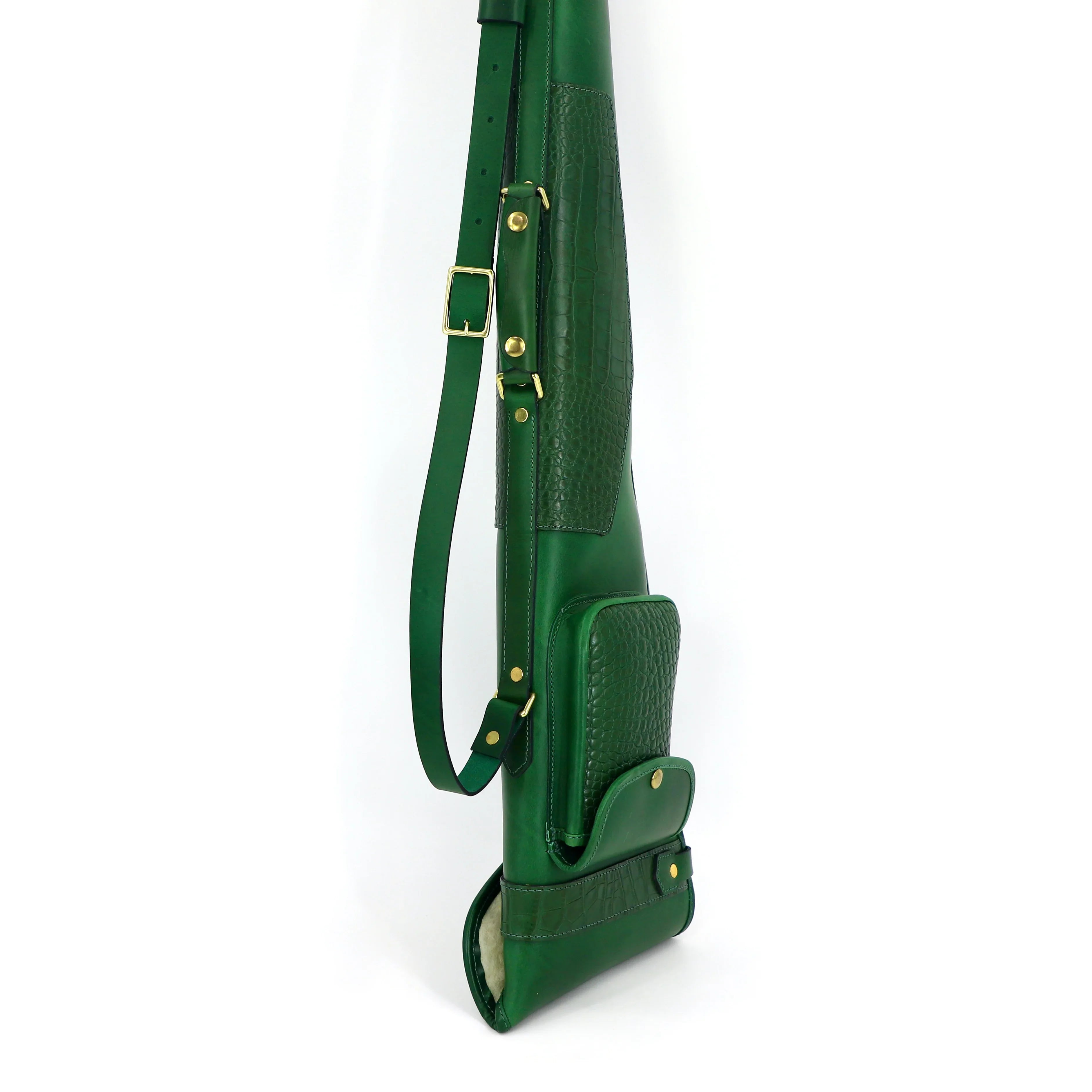 gun slip in green with matching mock crocodile skin. It features a luxurious sheepskin lining, a substantial outer pocket and eye-catching brass hardware upright with white background