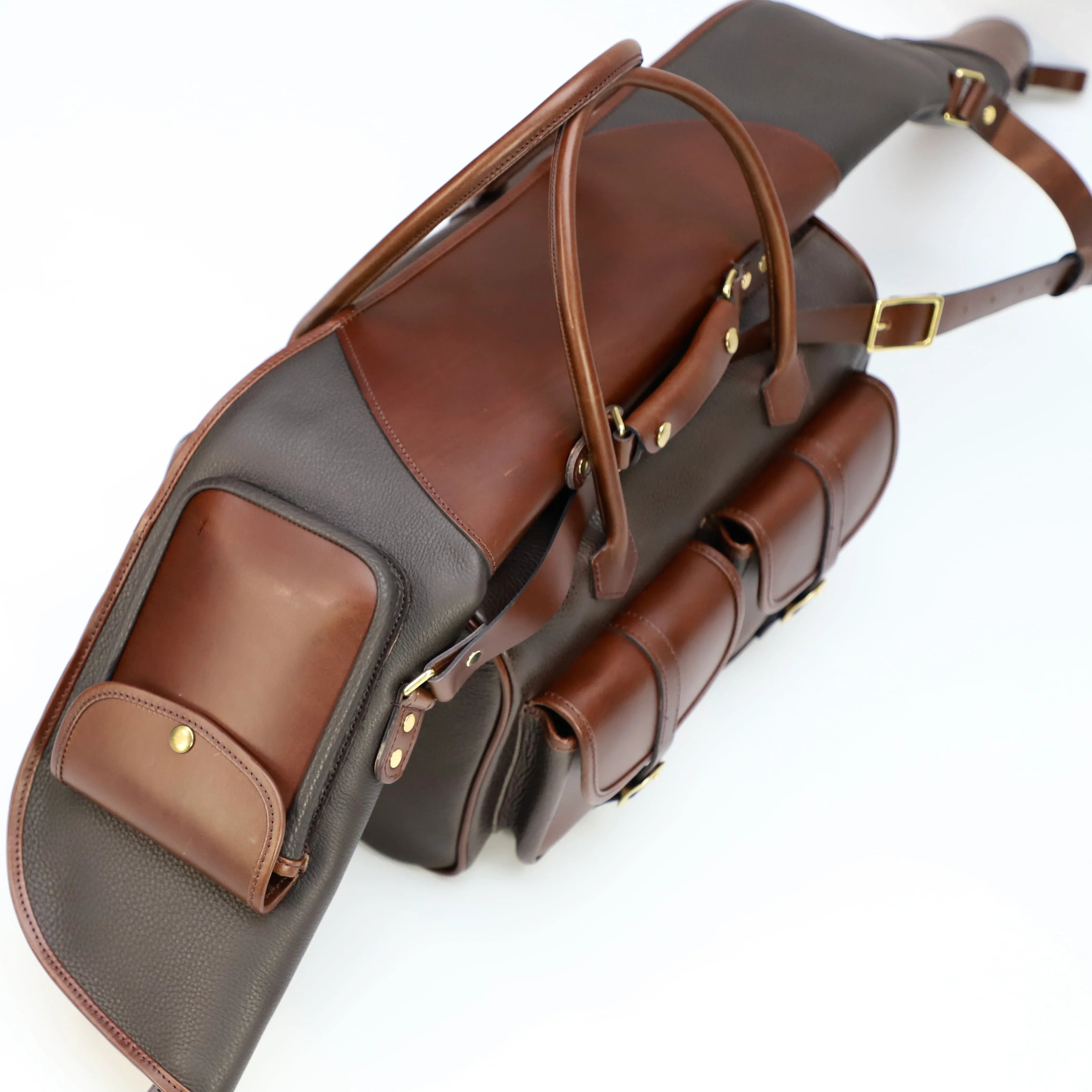 British Made Erin Russet Brown - Shooting Range Bag showcased with matching rifle gun slip laying on top of it