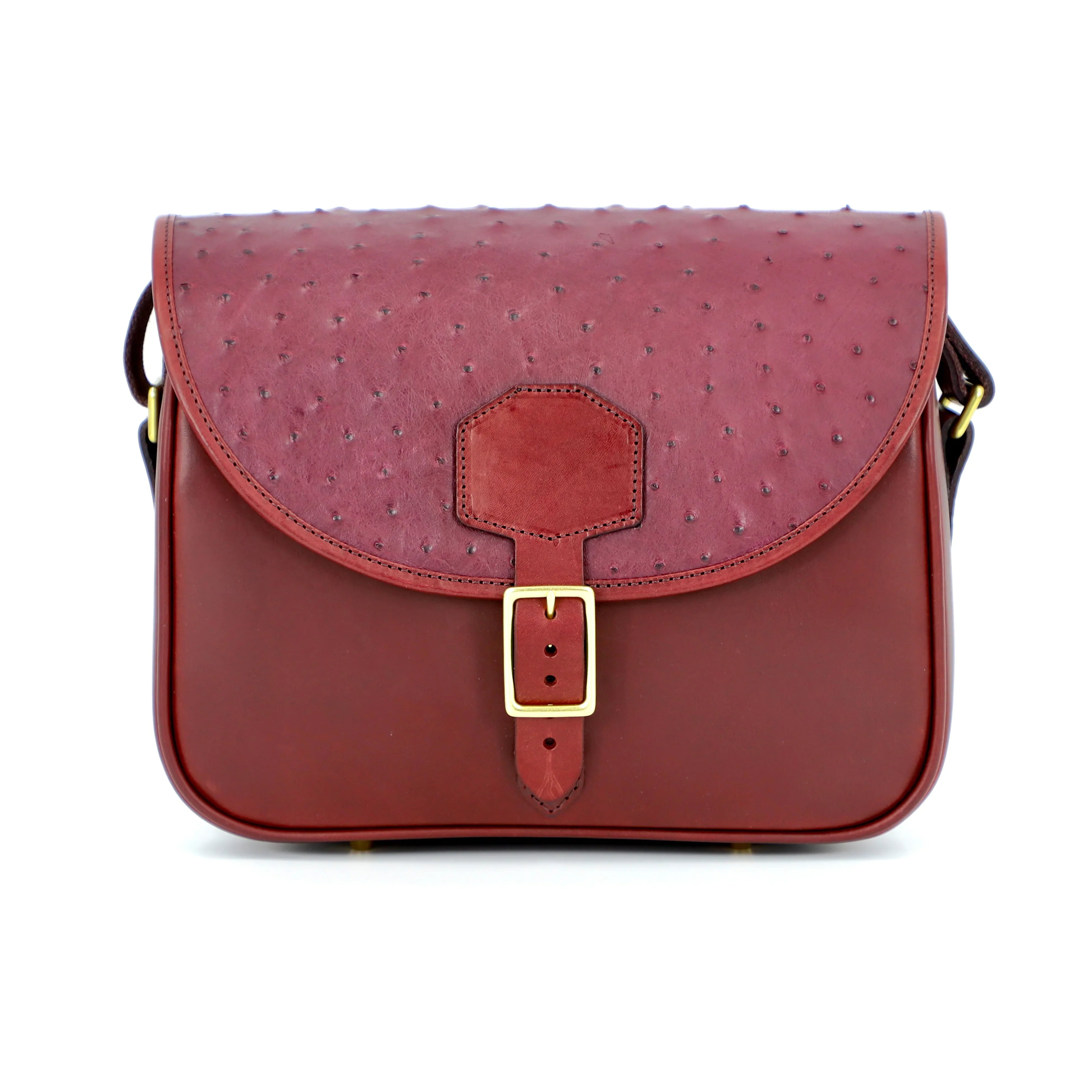 cartridge bag with ostrich material on flap and brass buckle front view