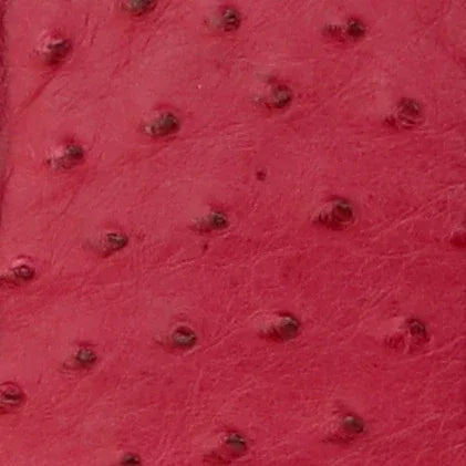 Close-up of burgundy Ostrich leather with a pattern of raised bumps.