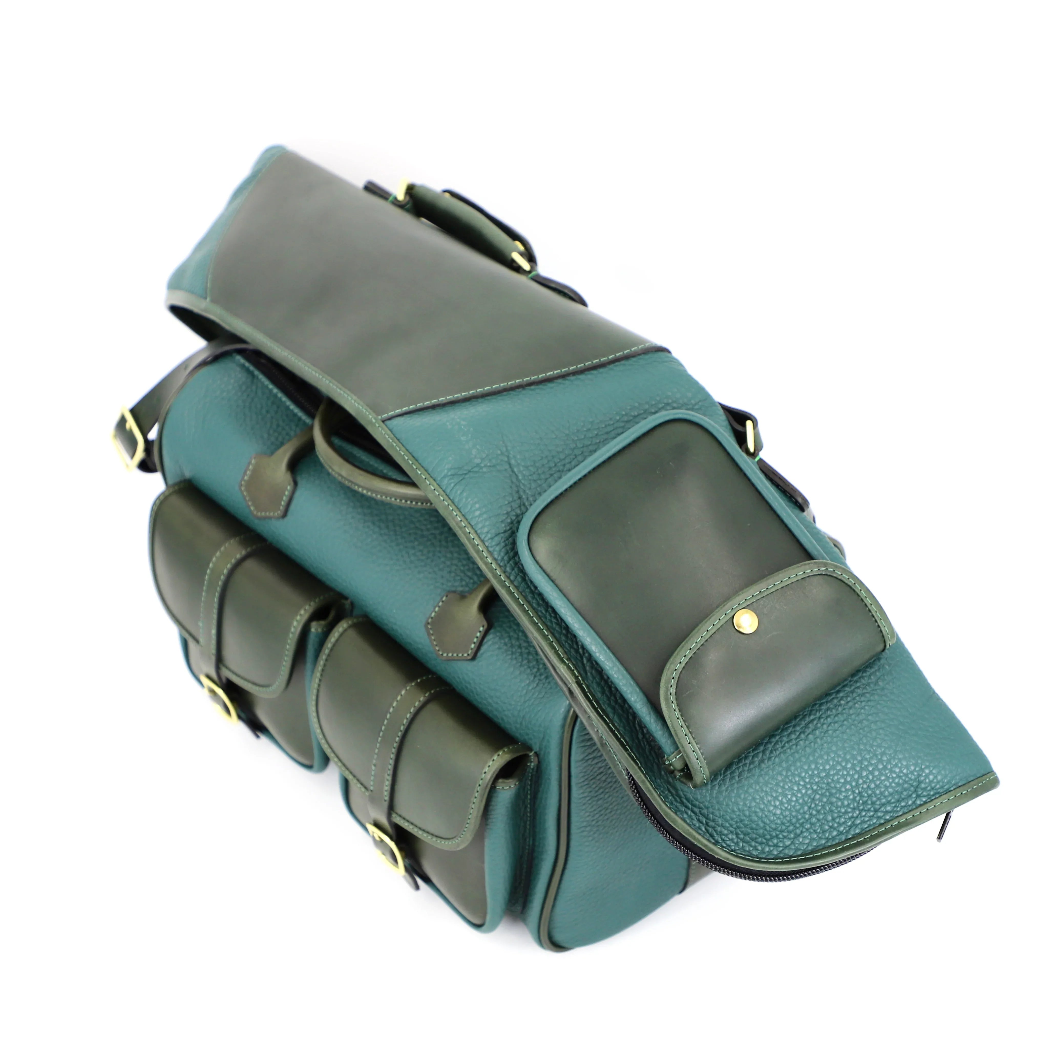 gun slip in pine green with soft and hard leather. gun slip folded over green leather bag