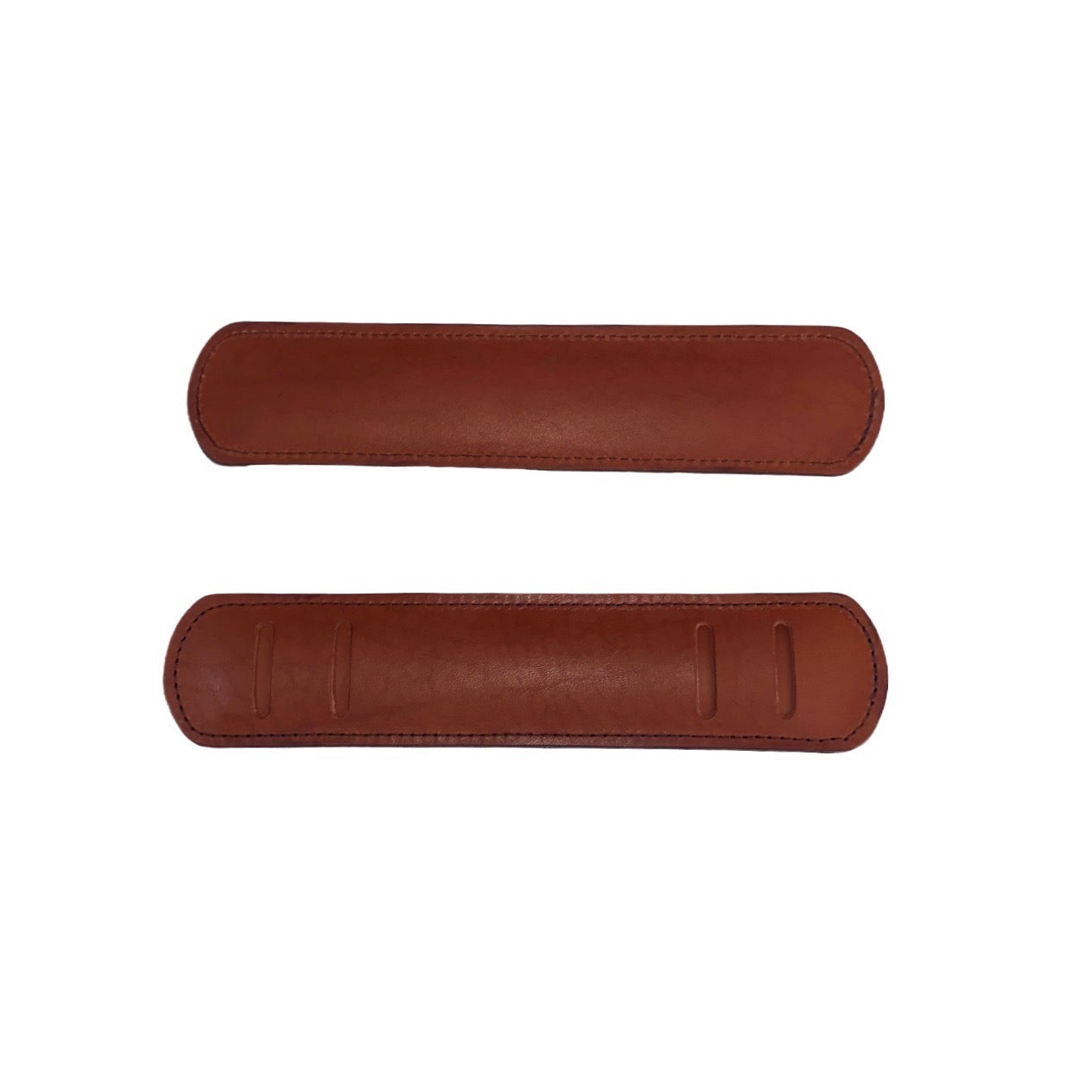 Two tan leather shoulder strap pads on a white background