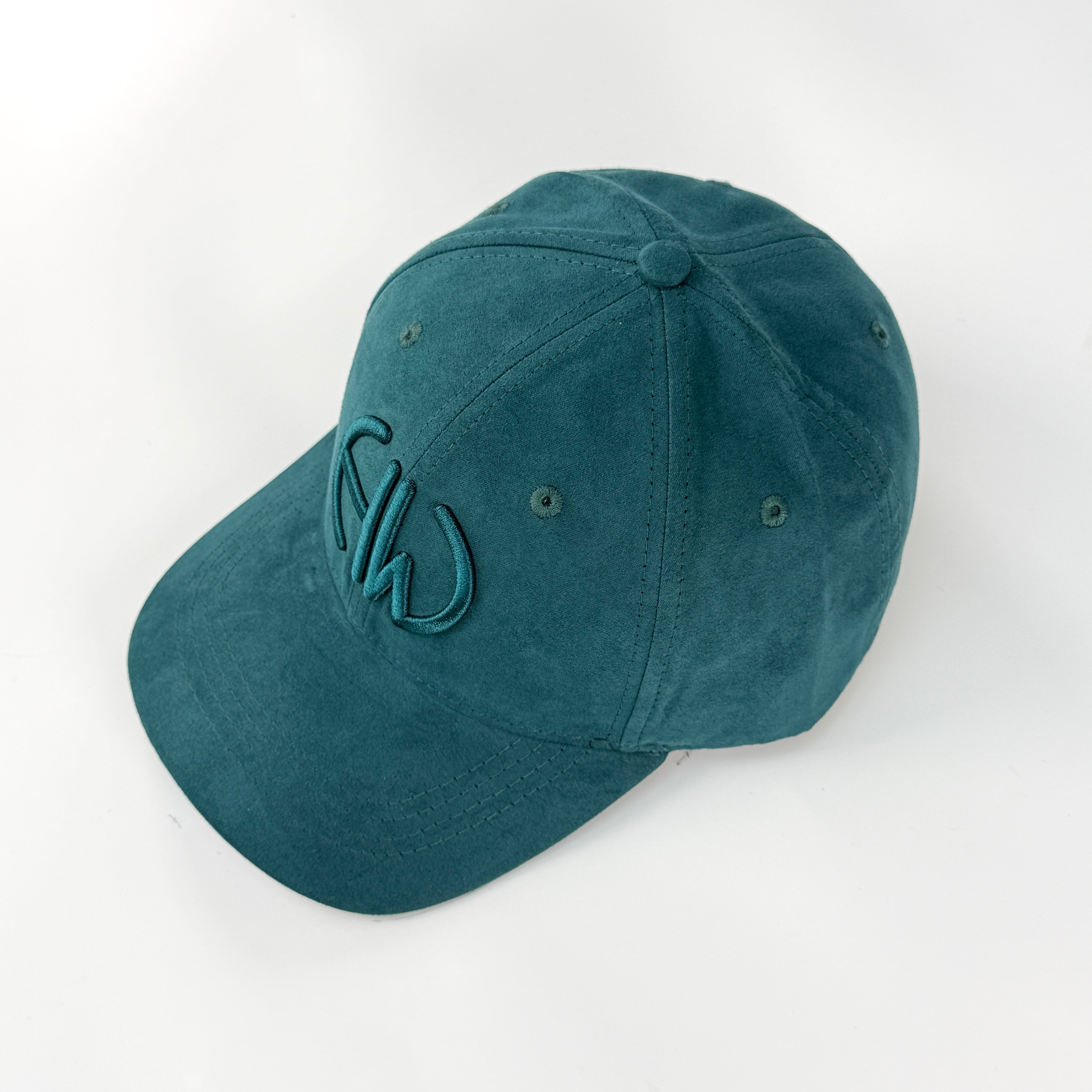 Suede baseball cap with a embroidered Howes an Wayko logo on a white background