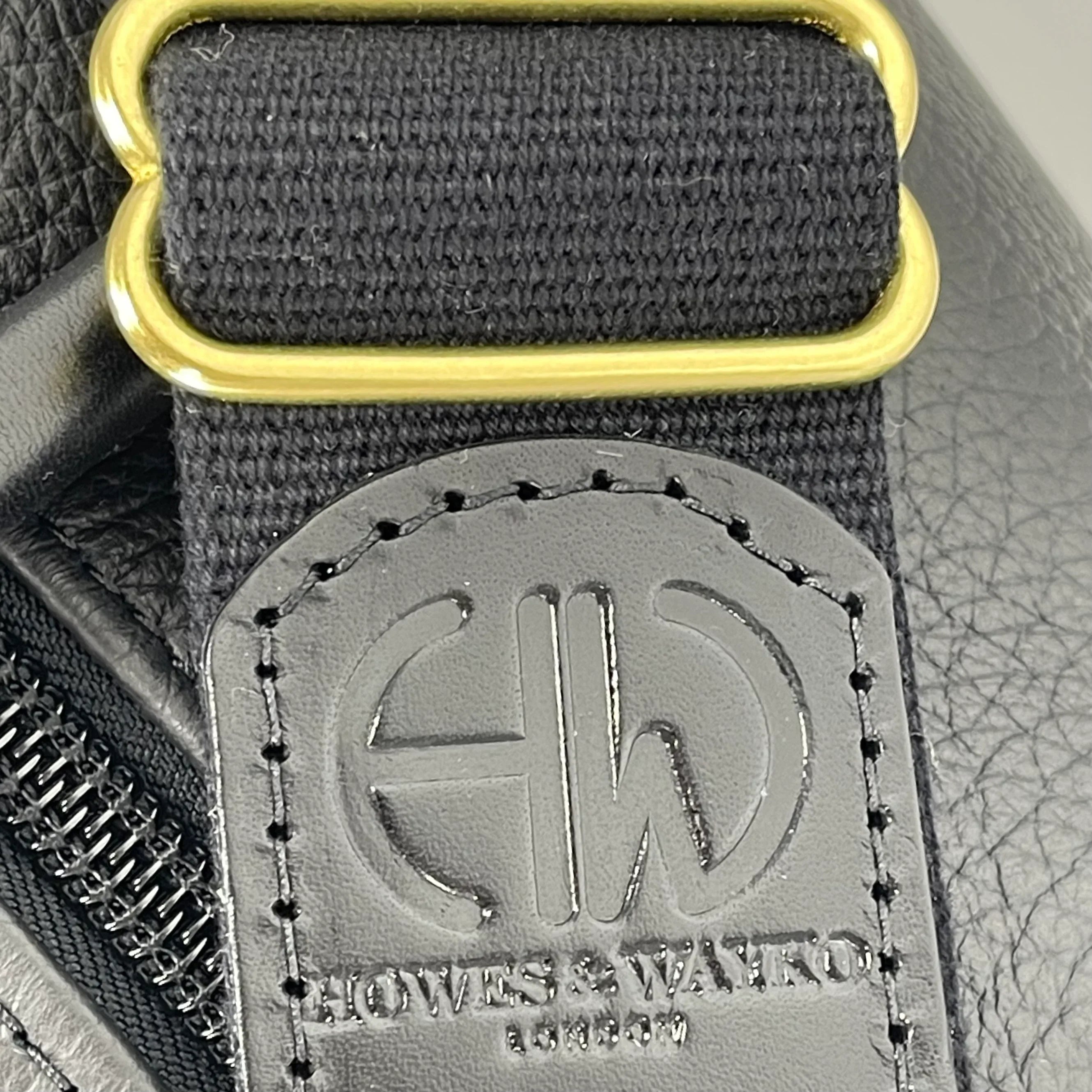 British Made Erin Greyson - Leather Range Bag close up of howes and wayko logo and strap buckle
