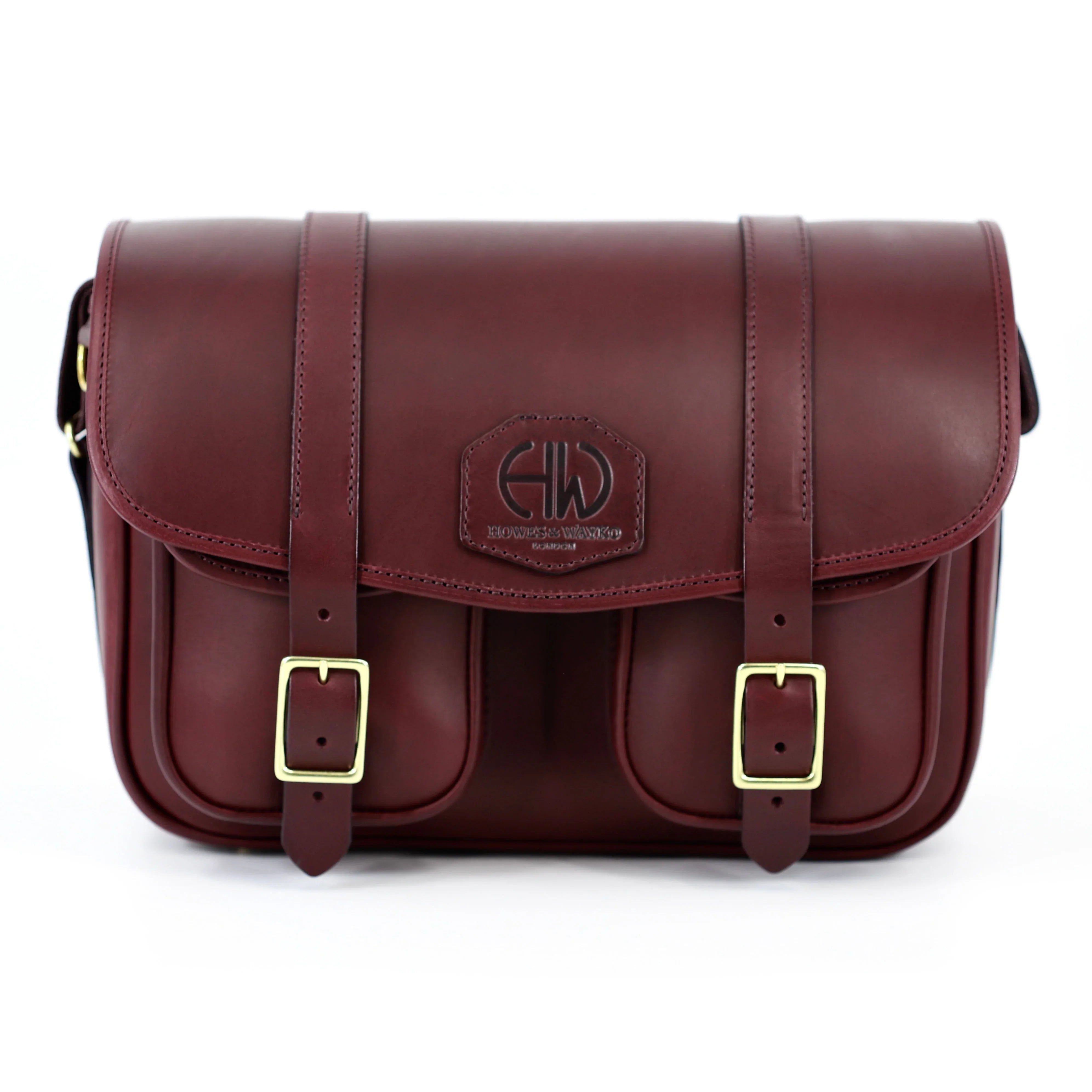 classic style leather range bag front view with front pockets with brass buckles
