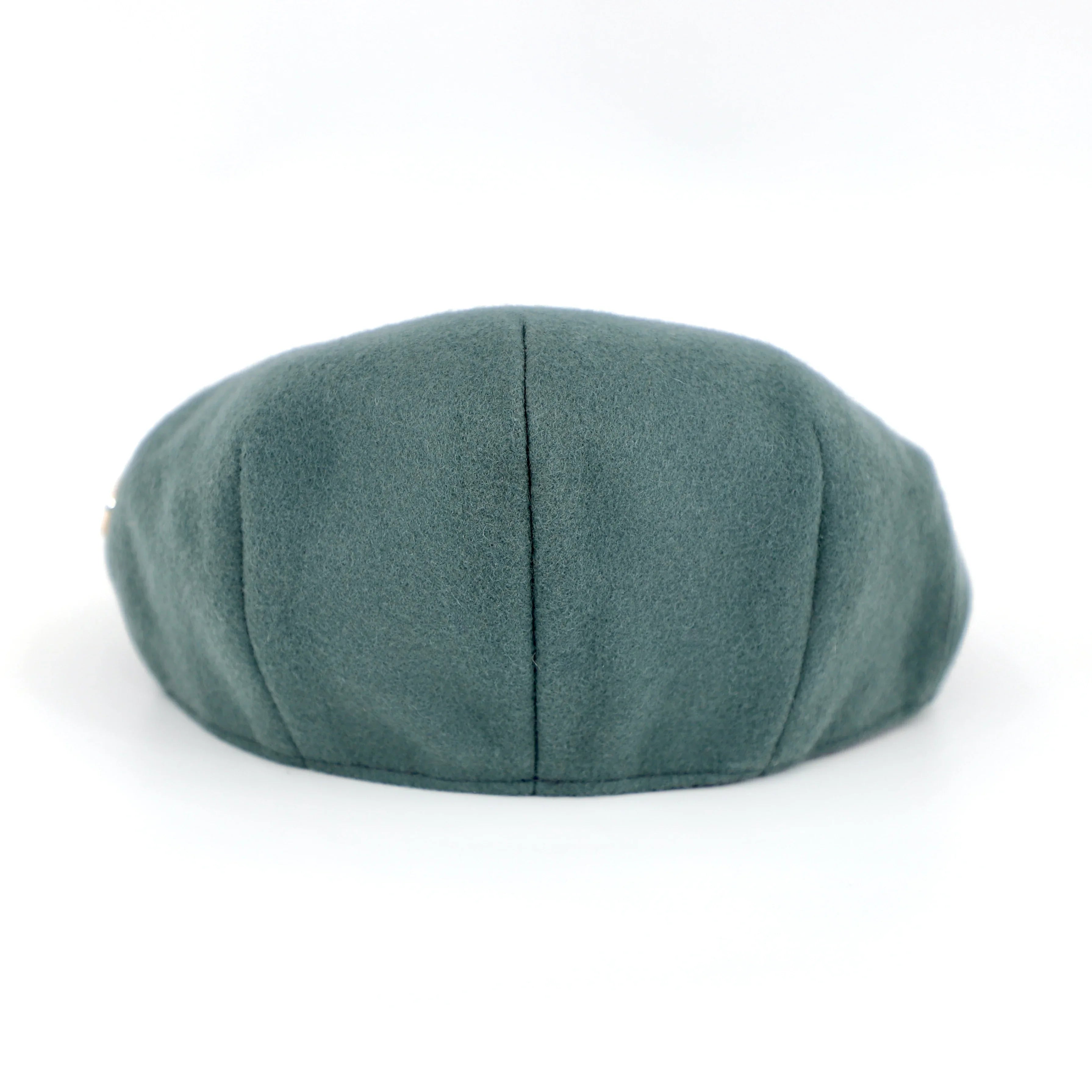 sage-coloured scally cap with HW logo rear view