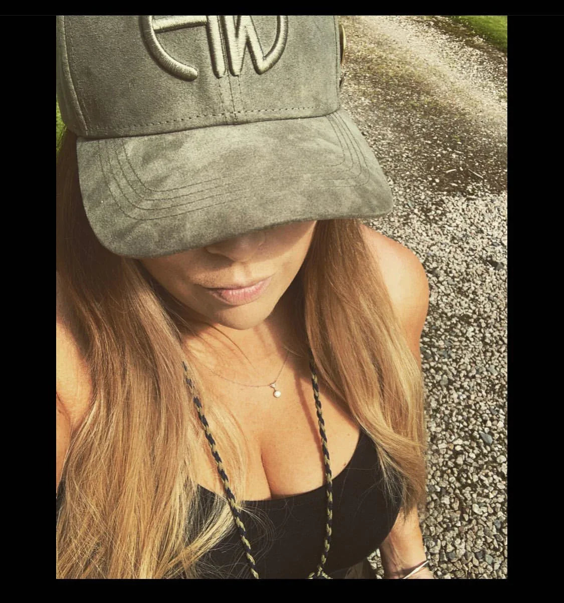 Iris Olive Green Baseball Cap - Shooting Baseball Caps adorned on a woman outdoors