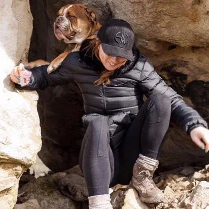 Iris Black Shooting Baseball Cap - Shooting Accessories adorned by a woman in the outdoors with her dog