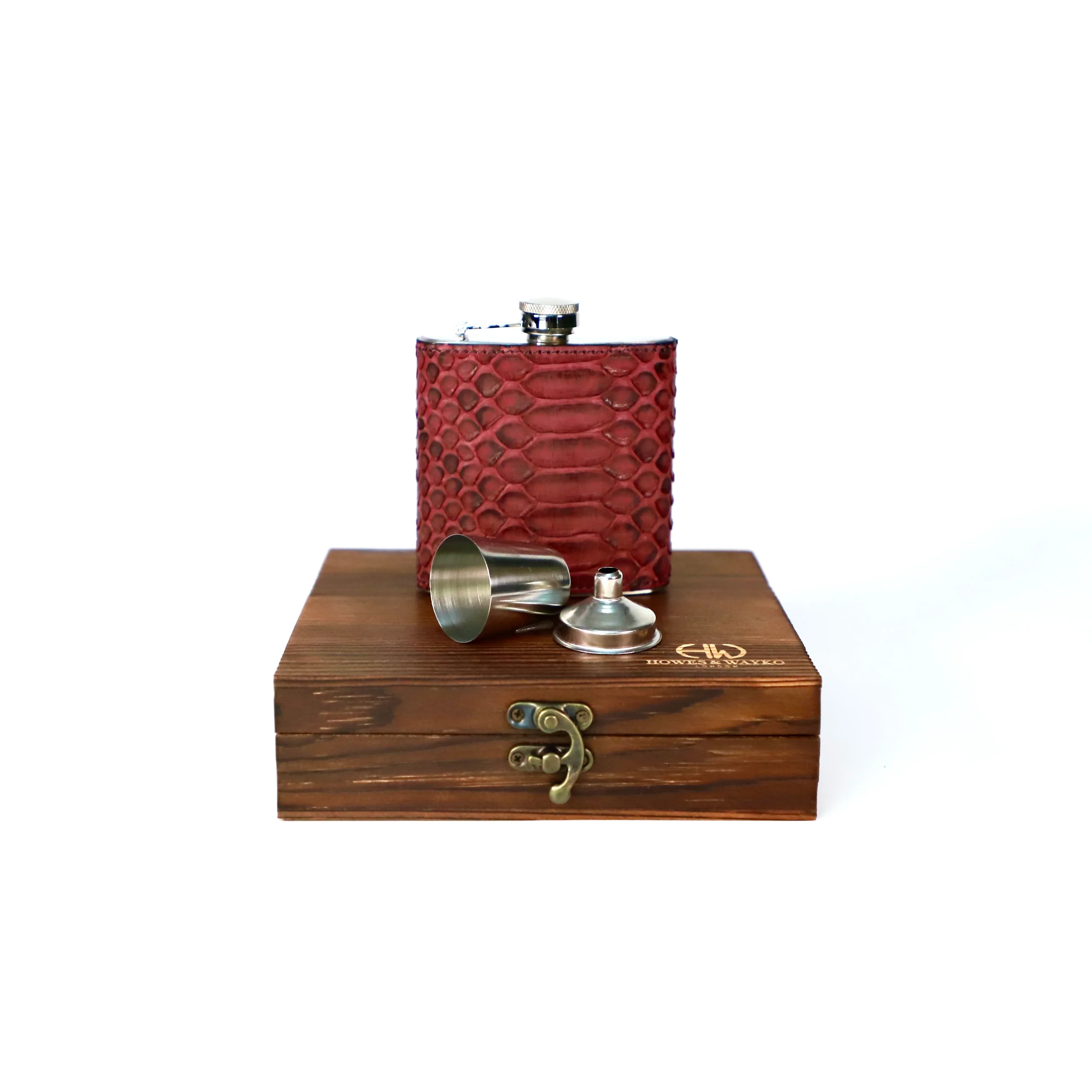Burgundy textured flask with silver cap and wooden box on a white background