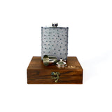 Silver  grey ostrich covered flask displayed on a wooden gift box with a white background