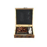 Giraffe print flask and shot glasses in a wooden box on a white background