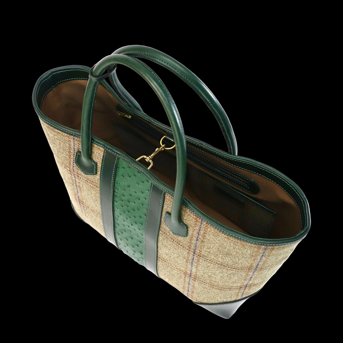 Green  Scottish tweed tote bag, finished with green veg tan leather and an Ostrich middle strip handbag on a white background