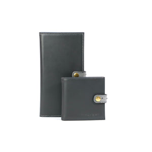  Two Grey leather shotgun certificate wallet, finished with a grey Ostrich clasp  with a gold fastener a white background