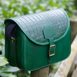 British Made Freya Edena - Shooting Cartridge Bags side view cartridge bag perched on a wooden post outdoors