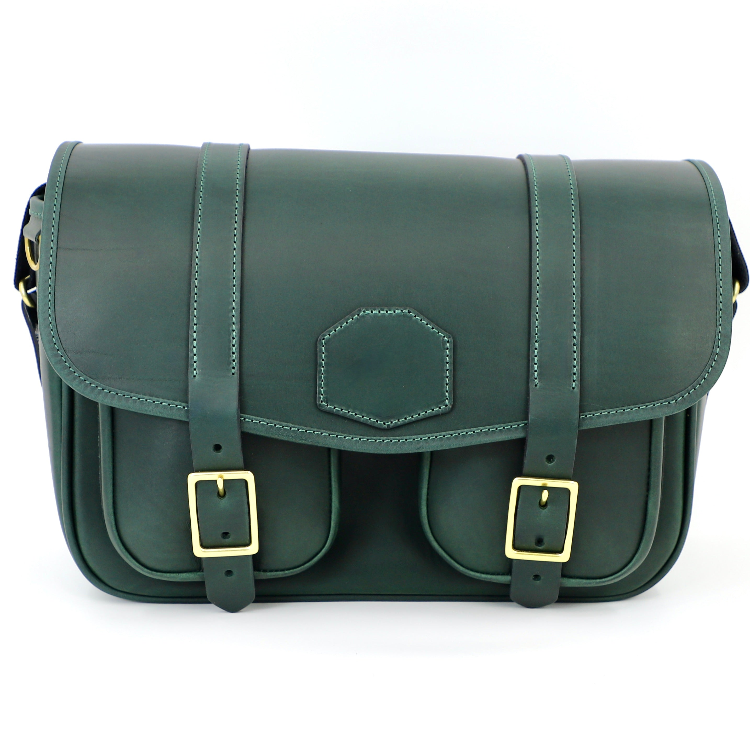 front facing green range bag with closed flap and brass buckles