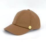 GAIA - Latte Wool Shooting Baseball Cap side view with howes and wayko brass logo shown