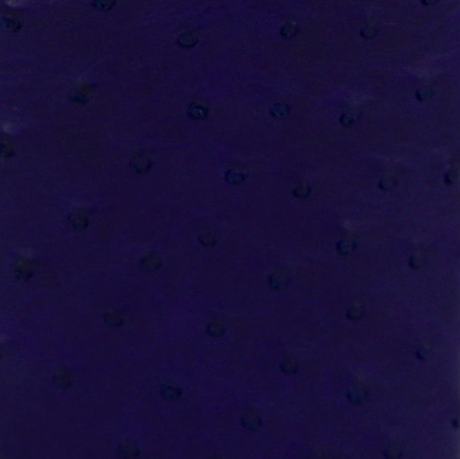 A close up of a purple leather