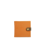 Tan leather wallet with a Snake clasp with a gold buckle on a white background