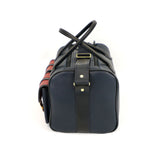 a leather range bag with contrasting pockets end view on white background