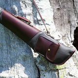 Leto Brown Gun Slip - Fleece Lined Leather Gun Protector showcased hanging on a tree