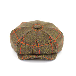 Gatsby tweed cap by Howes and Wayko, features Overchecked Tweed in earthy green with a splash of orange. Front view