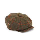 Gatsby tweed cap by Howes and Wayko, features Overchecked Tweed in earthy green with a splash of orange. Side view