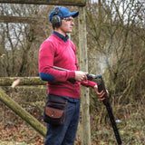 Algon Jumper Cranberry - Premium Shooting Clothing adorned on a man in a field while he is wearing howes and wayko shooting accessories